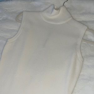 White turtle neck dress, a bit above the knee. Comfy light knit